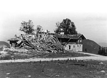 Black and white photograph of a partially collapsed building