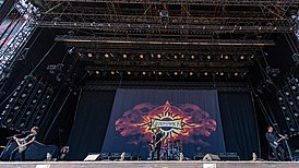 Выступление Godsmack в Rock im Park в 2019 году. Слева направо: Робби Меррилл, Салли Эрна, Шеннон Ларкин и Тони Ромбола.