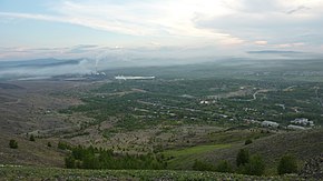 Вид на город и застоявшийся в Соймановской долине дым металлургического производства. 2011 год