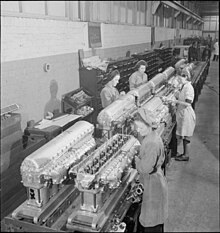 An image of female workers on an engine assembly line