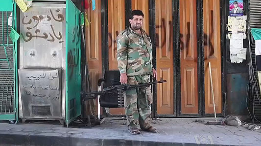 Повстанец ССА, вооруженный ручным пулеметом (Алеппо, октябрь 2012)