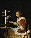 Молодая женщина в красной куртке кормит попугая. 1663. Дерево, масло. Частное собрание
