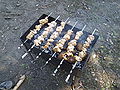 Мясо в мангале на шампурах и запекаемая на углях картошка