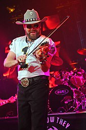 Hank Williams Jr playing a violin