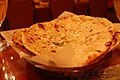 Paratha (парАтха, в данном случае - с мятой), пшеничная лепёшка с начинкой, выпекаемая не в тандуре. Начинка может быть разной (картофель, панир и т.д.), но не сладкой.