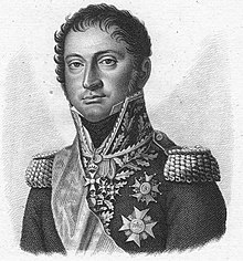 Print shows a clean-shaven man with dark hair looking directly at the viewer. He wears a dark military coat with epaulettes and several medals.