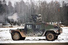 M2 на HMMWV 173-й воздушно-десантной бригады США на полигоне Графенвёр, ФРГ. 4 февраля 2014.