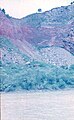 Барановский вулкан, вид на каменную осыпь с левого берега реки Раздольная, фотография сделана в 1983 году.