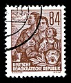 Серия почтовых марок «Пятилетний план». 1953. Семья перед высотным зданием Ан-дер-Вебервизе